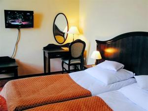 Posteľ alebo postele v izbe v ubytovaní Hotel Zamek Królewski w Rydzynie