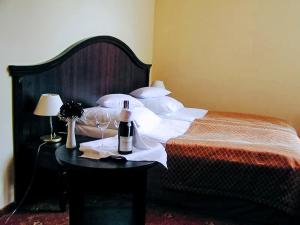 Posteľ alebo postele v izbe v ubytovaní Hotel Zamek Królewski w Rydzynie