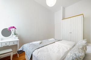a bedroom with a bed and a dresser and a mirror at Hostel Globo in Šibenik