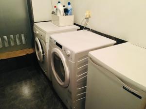 a laundry room with a washer and dryer at Casa Berganzo, Rioja Alavesa in Berganzo
