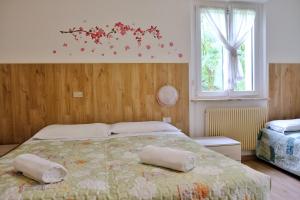 Postel nebo postele na pokoji v ubytování Hotel Dolomiti
