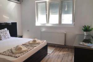 Posteľ alebo postele v izbe v ubytovaní Apartments Ivan