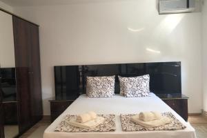 Posteľ alebo postele v izbe v ubytovaní Apartments Ivan