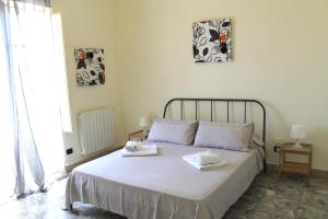 Cama ou camas em um quarto em Casa Vistosa Agrigento