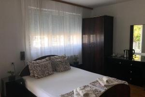 Posteľ alebo postele v izbe v ubytovaní Apartments Ivan