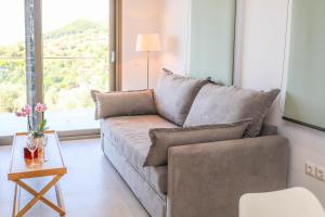 a living room with a couch and a table at Georgia Villas in Skiathos