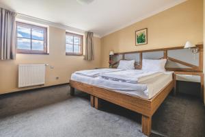 A bed or beds in a room at Hotel Resort Relax