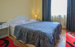 Postel nebo postele na pokoji v ubytování Hotel Decebal Bistrita