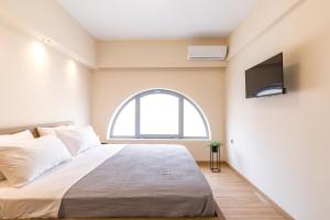 Posteľ alebo postele v izbe v ubytovaní Urban Lofts