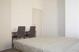 Posteľ alebo postele v izbe v ubytovaní Residenza Cappelli - Case Vacanze