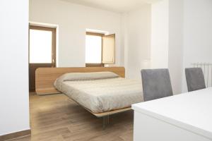 Posteľ alebo postele v izbe v ubytovaní Residenza Cappelli - Case Vacanze