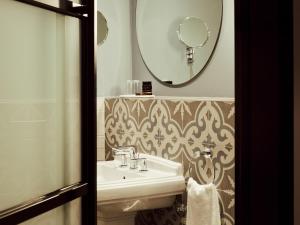a bathroom with a sink and a mirror at Gastwerk Hotel Hamburg in Hamburg +37 photos