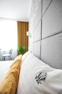 Posteľ alebo postele v izbe v ubytovaní Apartamenty Klasztorna 25