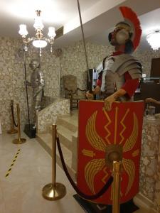 a statue of a man in a pirate costume in a museum at Hotel Atlantic Costinesti in Costinesti +120 photos
