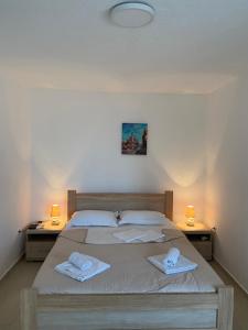 Postel nebo postele na pokoji v ubytování Apartments Boss
