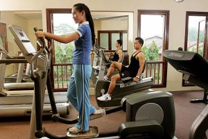 a group of people exercising on treadmills in a gym at Laras Asri Resort & Spa in Salatiga
