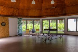 a room with a table and chairs and windows at Krokodyl Sport&Spa in Mielno +84 photos