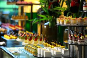 a display of desserts and pastries in a bakery at Crowne Plaza Chengdu Panda Garden, an IHG Hotel in Chengdu