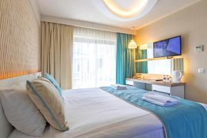 Кровать или кровати в номере The D Hotel Çeşme Resort