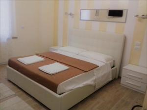 Postel nebo postele na pokoji v ubytování Dreaming Piazza Erbe Rooms