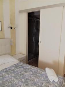 Postel nebo postele na pokoji v ubytování Dreaming Piazza Erbe Rooms