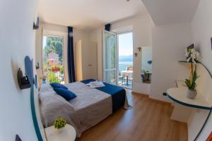 Postel nebo postele na pokoji v ubytování Hotel Torre Imperiale