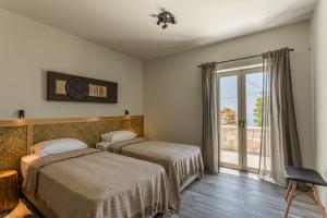 Кровать или кровати в номере Villa Achilleas