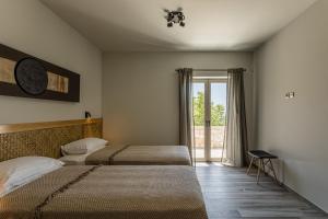 Кровать или кровати в номере Villa Achilleas
