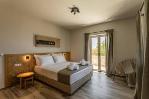 Кровать или кровати в номере Villa Achilleas