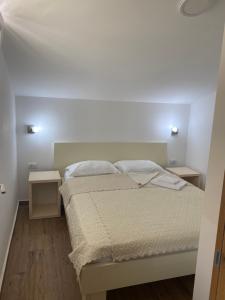 Postel nebo postele na pokoji v ubytování Apartments Boss