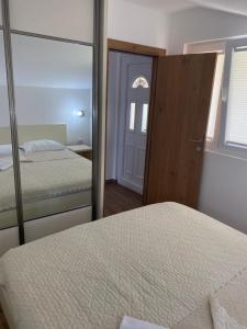Postel nebo postele na pokoji v ubytování Apartments Boss