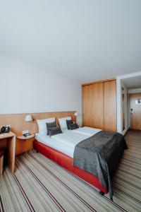 Tempat tidur dalam kamar di Hotel Ars Vivendi München