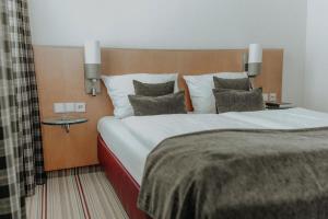Postel nebo postele na pokoji v ubytování Hotel Ars Vivendi München