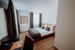 Postel nebo postele na pokoji v ubytování Hotel Ars Vivendi München