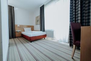Postel nebo postele na pokoji v ubytování Hotel Ars Vivendi München
