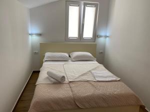 Postel nebo postele na pokoji v ubytování Apartments Boss
