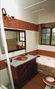 Koupelna v ubytování Khandizwe Kruger Villa