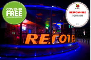 a neon sign that says recoilla in front of a building at Resotel in Villares de la Reina