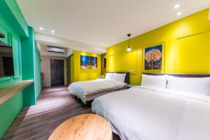 Rúm í herbergi á Talent Hotel