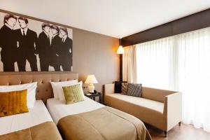 Säng eller sängar i ett rum på Quentin Berlin Hotel am Kurfürstendamm