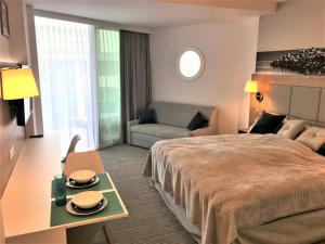 Łóżko lub łóżka w pokoju w obiekcie 6 piętro Seaside