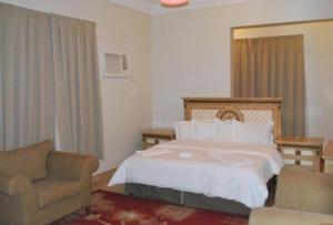 Ένα ή περισσότερα κρεβάτια σε δωμάτιο στο اصال حائل للوحدات السكنية المفروشة