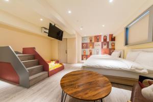 Rúm í herbergi á Talent Hotel