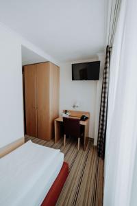 Postel nebo postele na pokoji v ubytování Hotel Ars Vivendi München