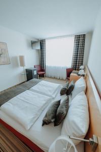 Postel nebo postele na pokoji v ubytování Hotel Ars Vivendi München