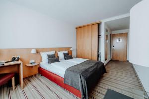 Postel nebo postele na pokoji v ubytování Hotel Ars Vivendi München