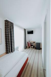 Postel nebo postele na pokoji v ubytování Hotel Ars Vivendi München