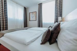 Postel nebo postele na pokoji v ubytování Hotel Ars Vivendi München