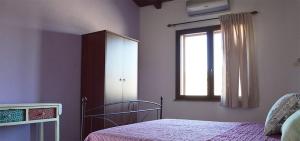 Postel nebo postele na pokoji v ubytování Agriturismo Sa Murta in Sennariolo-Oristano