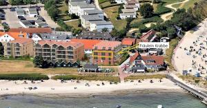 an aerial view of a beach and buildings at Fräulein Krabbe in Hohwacht